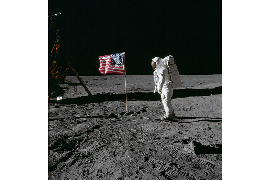 Astronaut Buzz Aldrin beside US flag（c）NASA