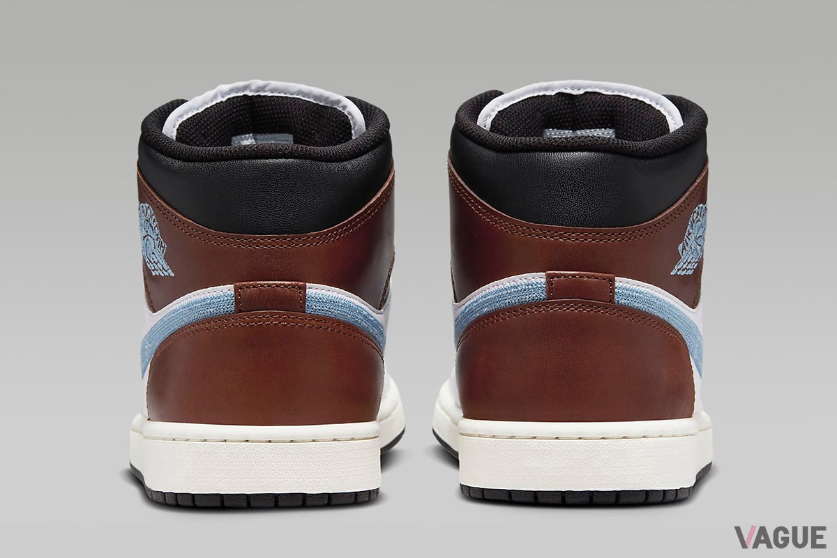 「エア ジョーダン 1 MID」の新色は、ホワイト、ブラウン、ブラックをバランスよく配置し、スウッシュとウイングロゴをライトブルーの刺しゅうで表現