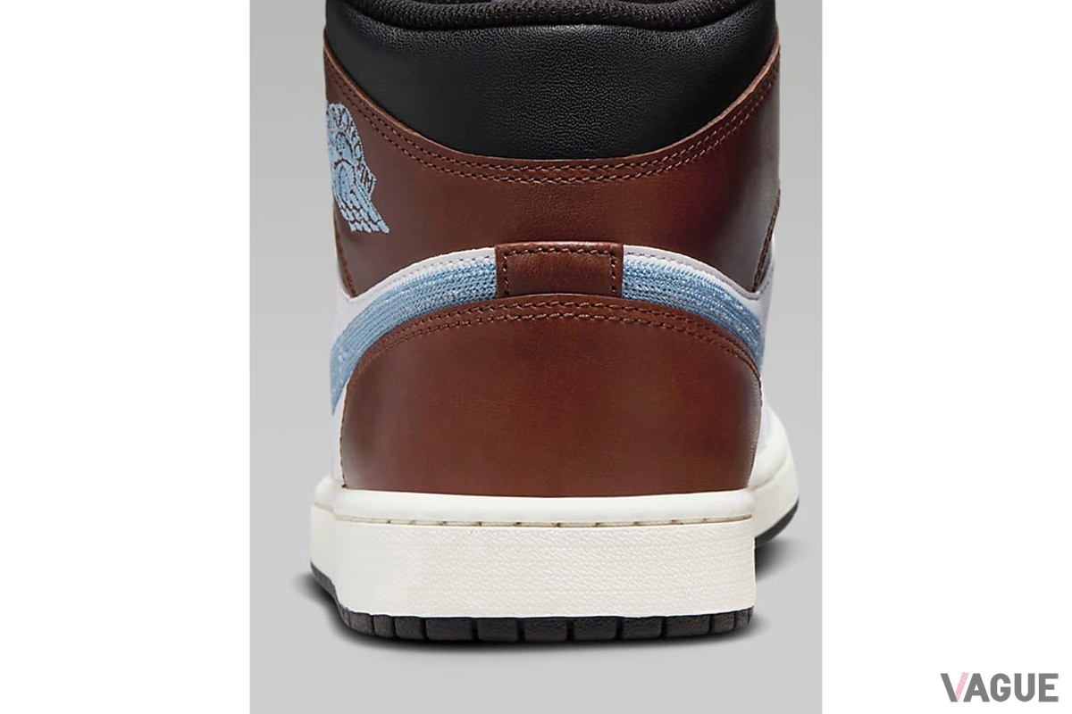 「エア ジョーダン 1 MID」の新色は、ホワイト、ブラウン、ブラックをバランスよく配置し、スウッシュとウイングロゴをライトブルーの刺しゅうで表現