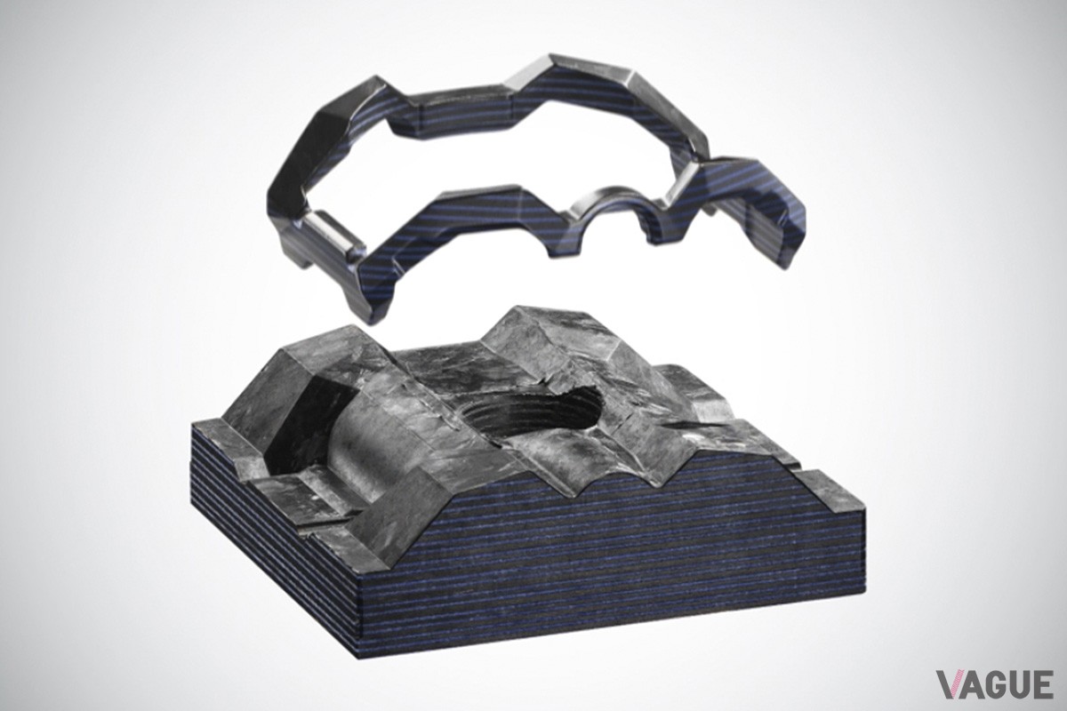 外部からの衝撃を効率的に逃してくれるバンド一体型フレーム。カーボンとグラスファイバーを織り重ねた複合素材はまるで地層のような美しさ